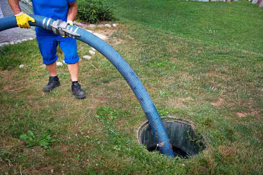 Cleaning sludge from septic system