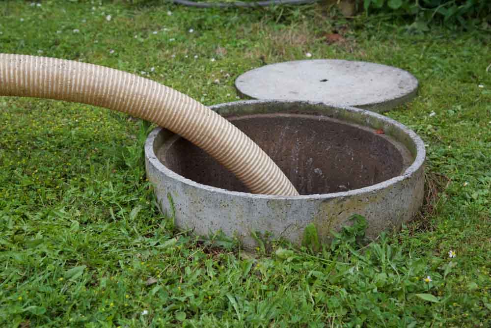 Septic tank removal of sewage sludge and cleaning