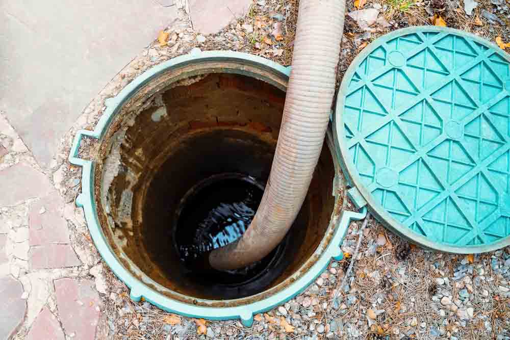 Las Vegas Septic Service technician working on septic system maintenance tasks