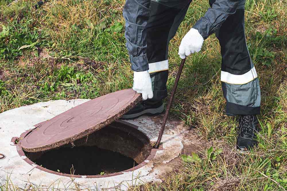 Las Vegas Septic Service inspecting a septic tank