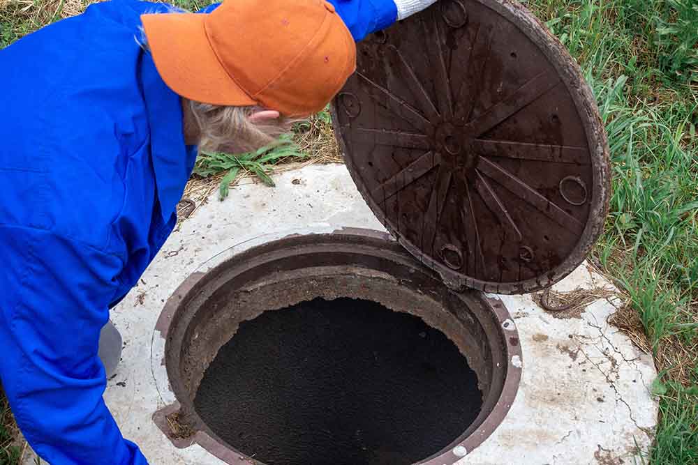 Las Vegas Septic Service technician inspecting a septic system