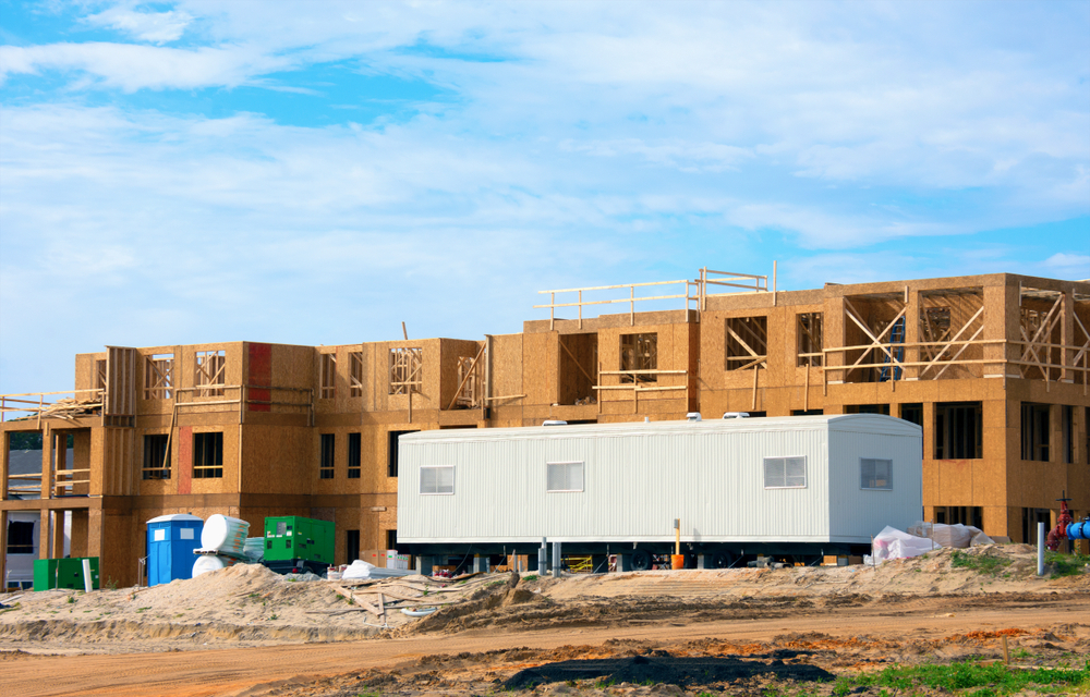 Large construction site half constructed wooden building